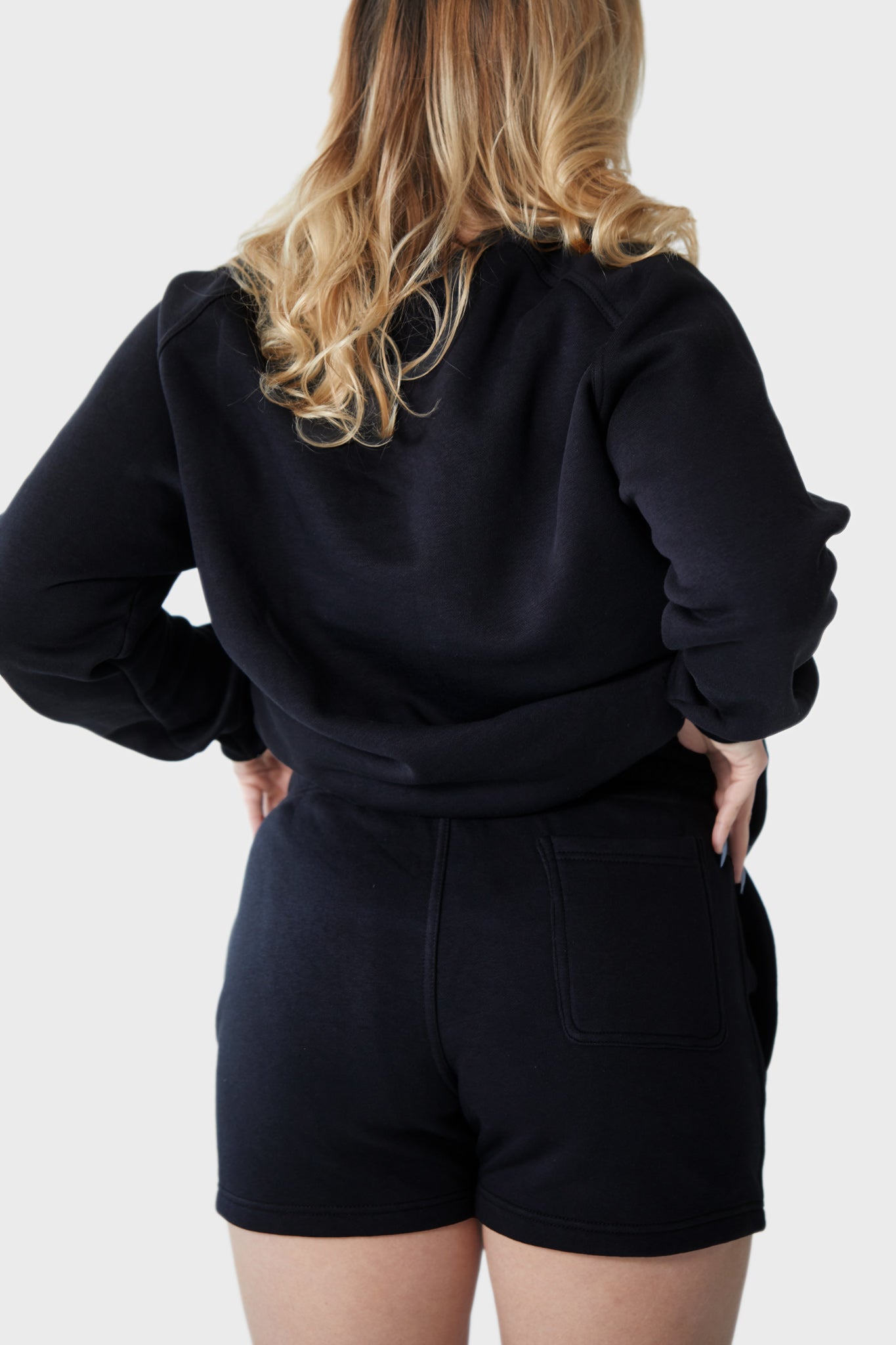 Women's Collegiate Jumper - Featuring our brand logo on the front. Adds a touch of sporty flair to your outfit. Long sleeves and high neckline provide additional warmth. Practical choice for colder weather. Suitable for running errands or lounging at home